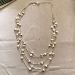 Silver necklace with layers of silver beads
